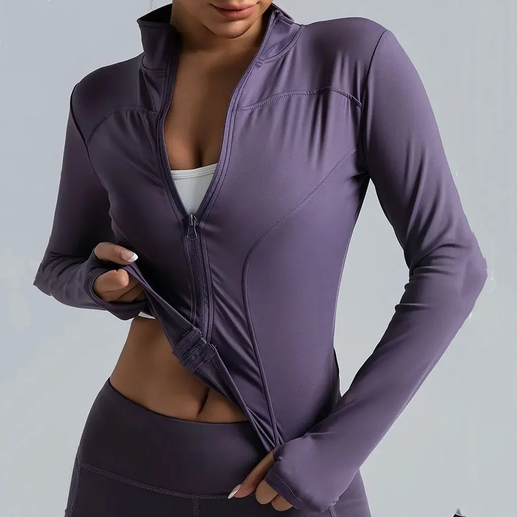 Women's zip-up running jacket. Lightweight, stretchy running jacket with thumb holes, a high collar, and breathable yoga workout wear.